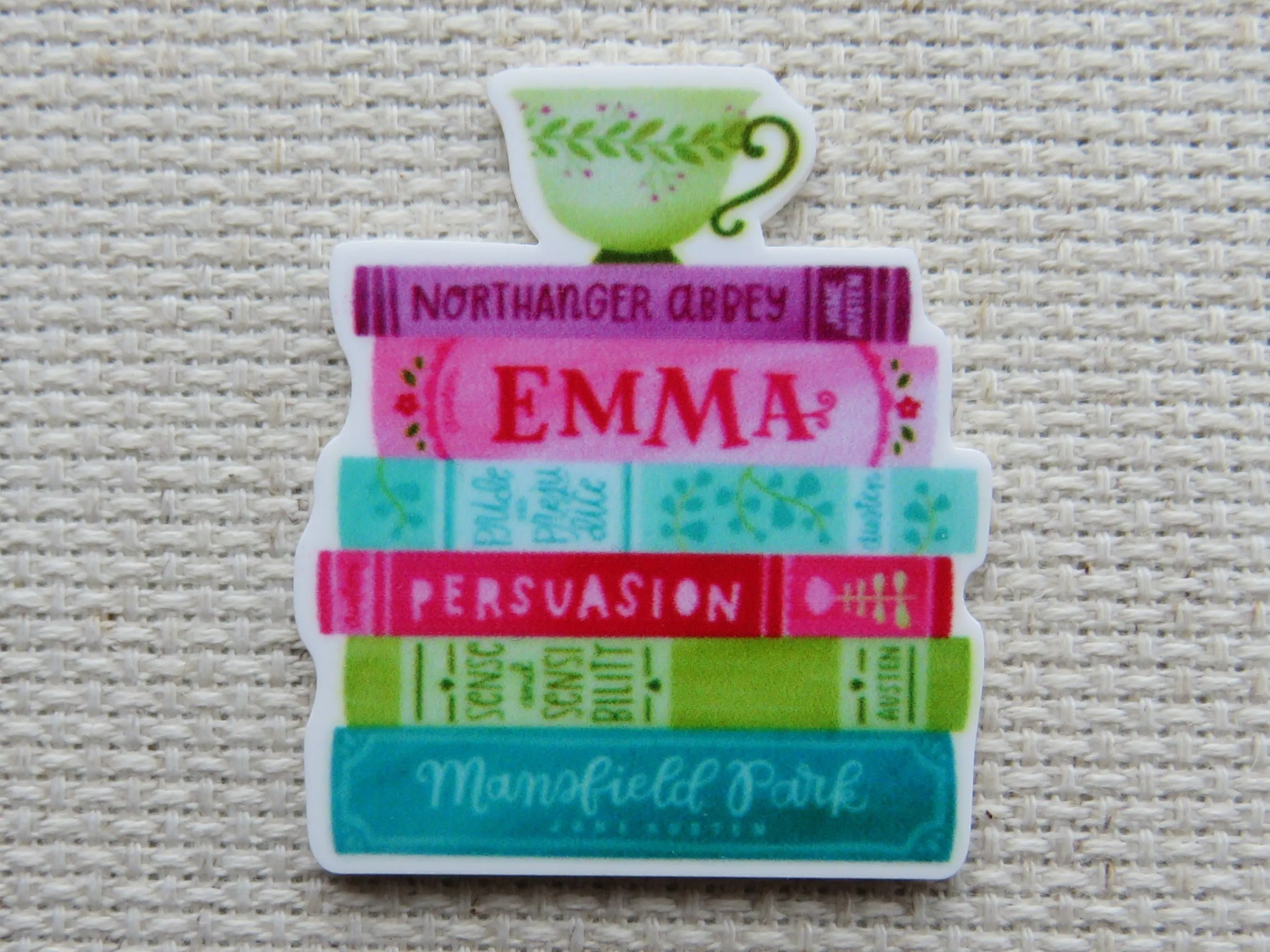 A Stack of Books with A Green Teacup Needle Minder, Cover Minder, Magnet