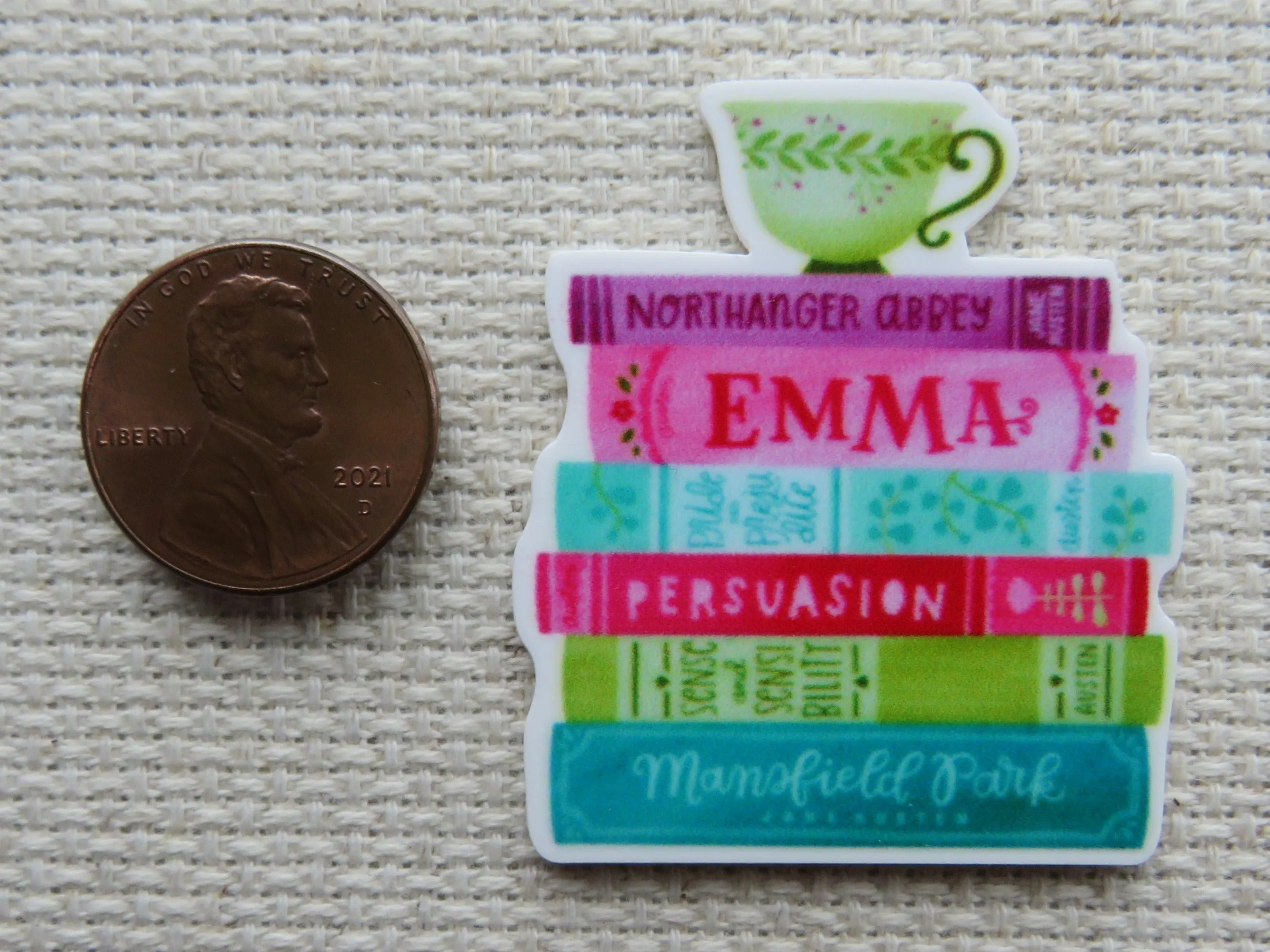 A Stack of Books with A Green Teacup Needle Minder, Cover Minder, Magnet